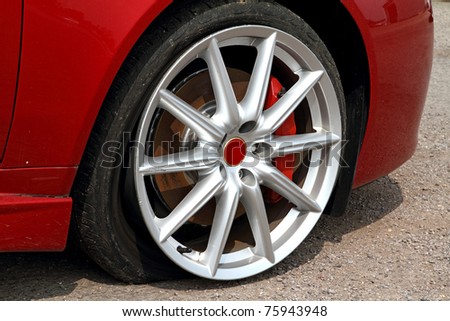 Deflated tyre damage to car wheel