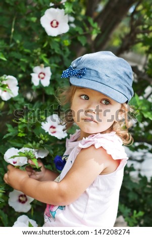 happy funny little girl with a flower