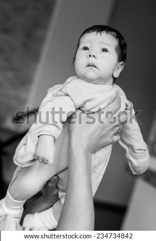 Newborn baby in the arms of his mother ( black and white )