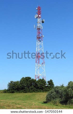 Communication tower over blue sky