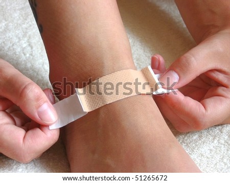 Putting plaster on foot