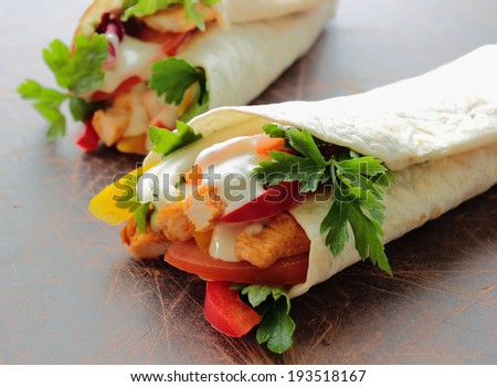 Tortilla wraps with chicken and fresh vegetables