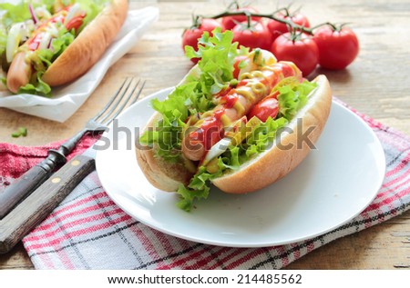 Traditional homemade dot dog with fresh sausage and vegetables
