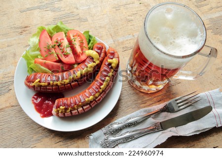 Barbecue with grilled sausages and cold beer