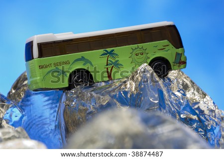 Sight seeing bus model on ice rocks
