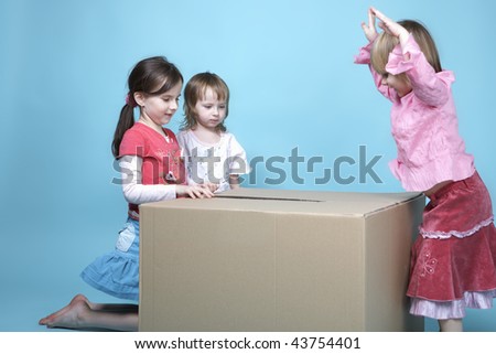 Children at play with paper box