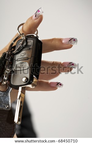 Car keys on fingers