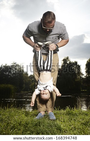 Man playing with his baby son