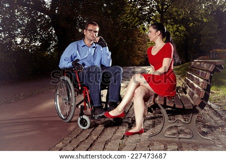 Disabled man on wheel chair with friend