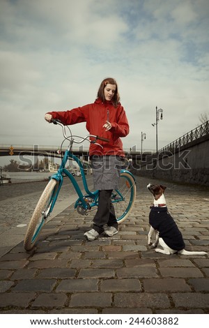 Walking of dog with retro bicycle