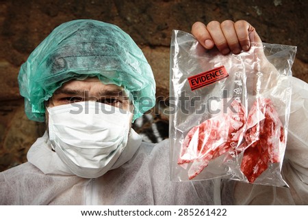 Crime scene investigation - specialist with evidence bag