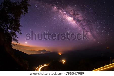 High mountains in the night with stars and the Milky Way in the beautiful night sky.