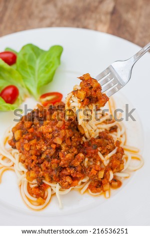 spaghetti pork sauce on fork