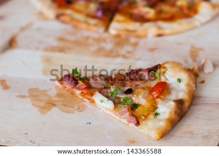 Pizza with bacon, garlic and dried chilli slice of pizza