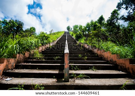 Old Concrete steps of temple with blue sky in Ranong,Thailand