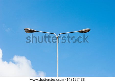 double street light lamp post or lantern on a blue sky background