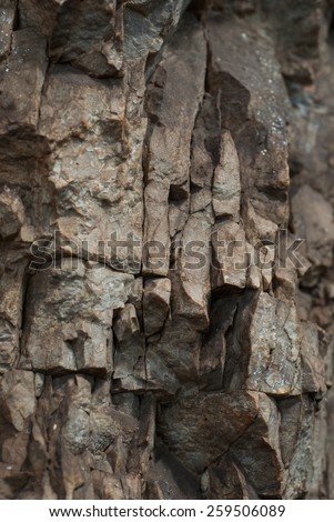 Rock texture. The view of the layers of weathered rock close up