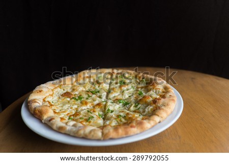 White Pizza , garlic and Mozzarella Cheese on white plate