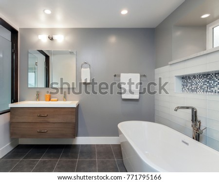 Designer Bathroom with Glass Shower and wooden cabinet