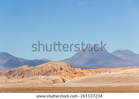 Licancabur Volcano at Atacama, Chile. The Atacama Desert is a plateau in South America, covering a 1,000-kilometre (600 mi) strip of land on the Pacific coast, west of the Andes mountains.