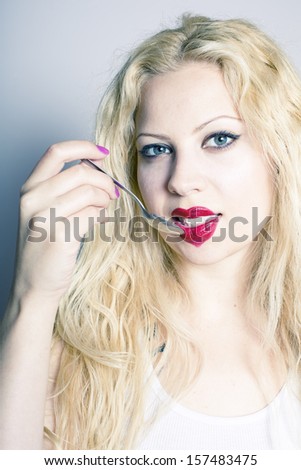 beautiful blond woman face with heart shaped red lips