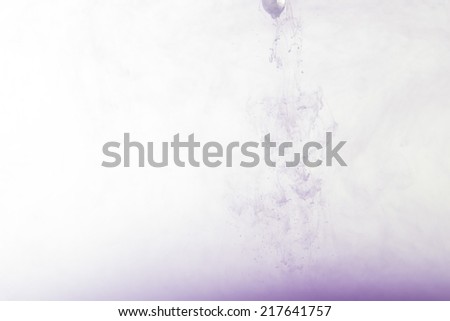 flowing purple ink in water, colored smoke