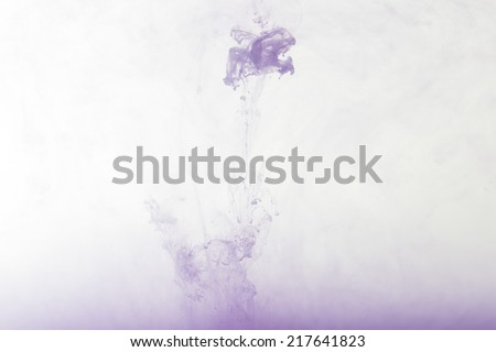 flowing purple ink in water, colored smoke