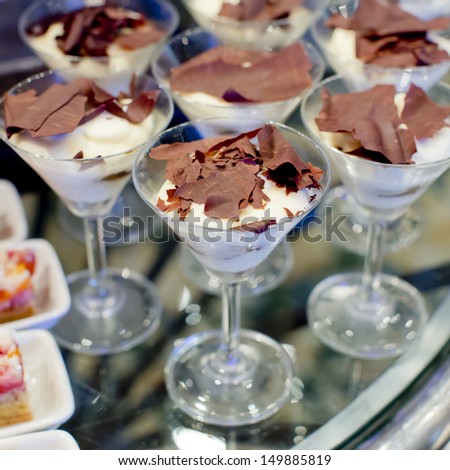 Gourmet catering for a special occasion with a buffet table filled with a selection of individual desserts