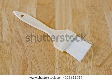 pastry brush baking utensils ona wood background