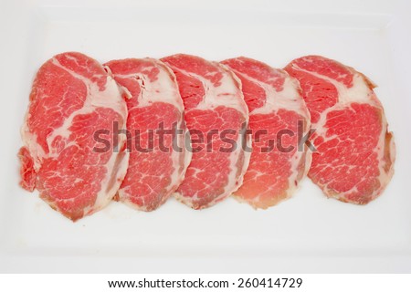 High grade sliced Hida wagyu beef isolated on white background
