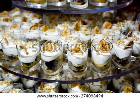 Dessert Finger Food with banana topping in small glass