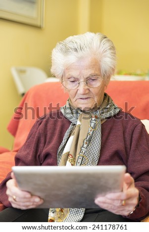 Grandma learning to use a tablet for business