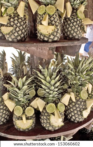 Yucatan, Mexico, 2008. Decorated pineapples with limes as eyes, ears, nose, mouth and hair.