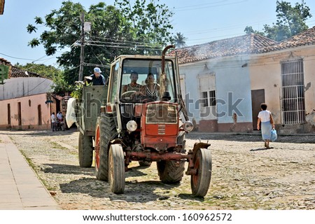 TRINIDAD, CUBA, OCTOBER 27, 2009. A man driving a tractor with a trailer, in Trinidad, Cuba, on October 27th, 2009.