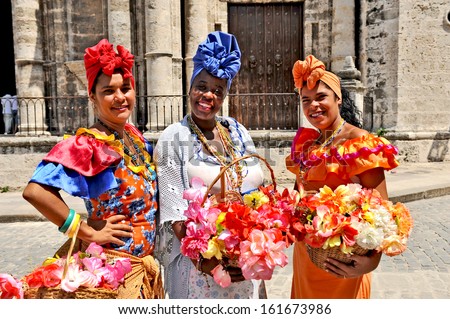HAVANA, CUBA, MAY 6, 2009. Three Cuban women in traditional dresses in Havana, Cuba, on May 6th, 2009.