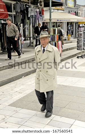 OHRID, MACEDONIA, MAY 17, 2011. A stylish old man walking on the street, in Ohrid, Macedonia, on May 17th, 2011.