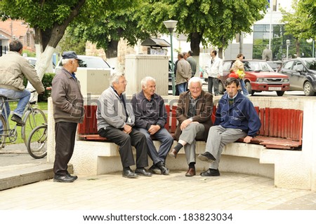BITOLA, MACEDONIA, MAY 19, 2011. Old men sitting on a park bench in Bitola, Macedonia, on May 19th, 2011.