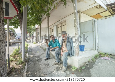 DILIJAN, ARMENIA, JULY 31, 2014. Two old men sitting on a porch of a house in Dilijan, Armenia, on July 31st, 2014.