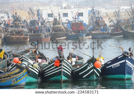 AGADIR, MOROCCO, FEBRUARY 27, 2014. Fishermen and lots of small and big fishing boats in the harbour of Agadir, Morocco, on February 27th, 2014.