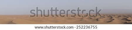 A desert camp in the Sahara desert in Erg Chegaga in Morocco in the spring during a hot sunny day.