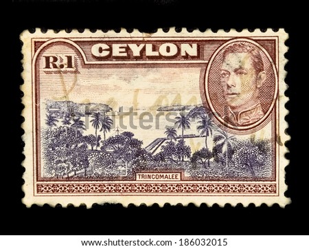 SRI LANKA-CIRCA 1937: An old Ceylon postal stamp shows image of Trincomalee & King George VI, circa 1937