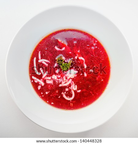 beet soup on white plate