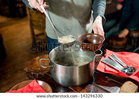 pouring the soup