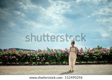 lady in the garden of roses
