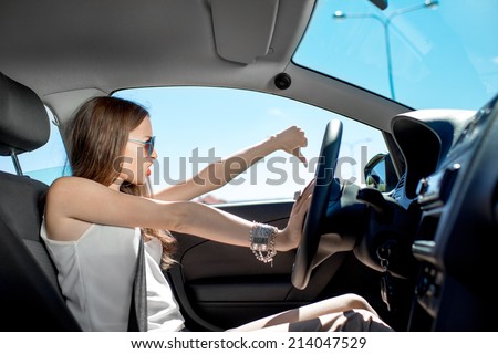 Young elegant woman hurry to work while standing in traffic