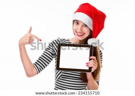 Young woman holding and showing digital tablet with empty screen on Christmas isolated on white background