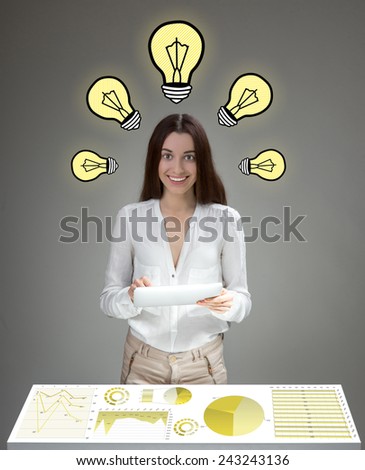 Young inventive woman having ideas analyzing business plan with digital tablet and big table screen