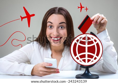 Young and smiling woman typing message with mobile phone worldwide with graphic globe in studio. Roaming concept