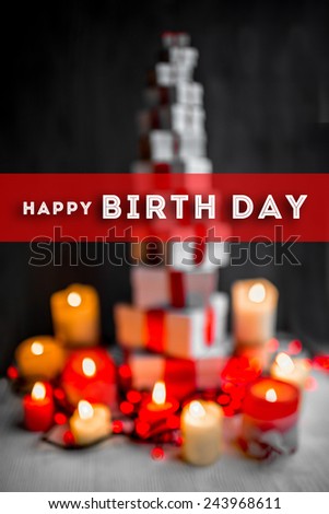 A pile of gift boxes with red ribbons on wooden background with greeting text. Greeting card concept
