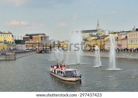 Moscow, Russia, May, 24, 2014. Russian scene: River trips on the Moscow river, view for the fountains in the Vodootvodny canal in Moscow near Bolotnaya square at dusk